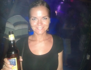 Jurgita at a beach party with her favorite beer; Kilimanjaro.