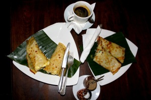 Pancakes filled with egg and spinach. Plus coffee with spice.